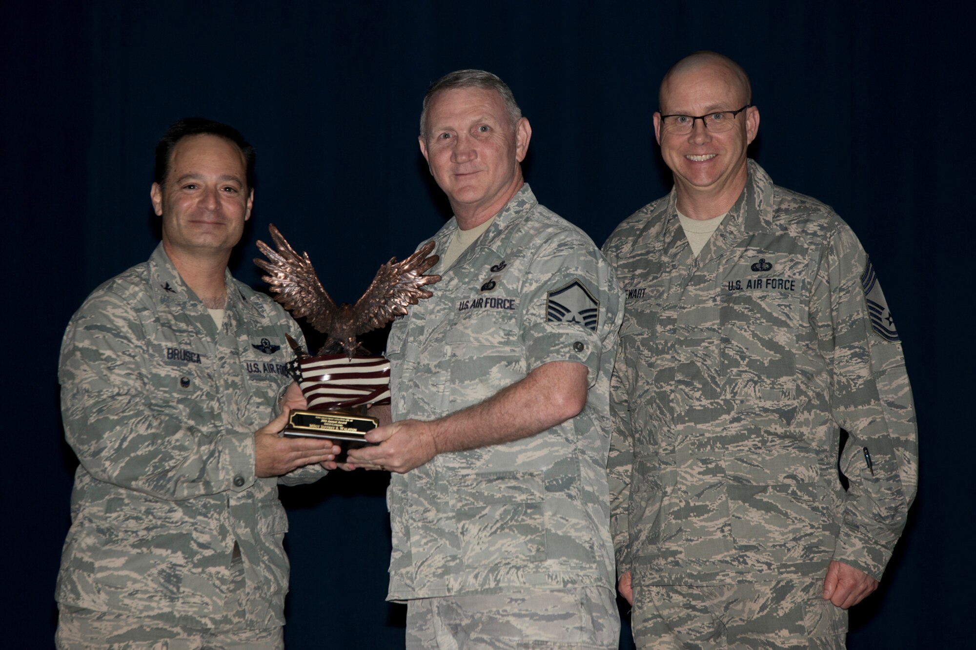 U.S. Air Force Reserve Col. Anthony Brusca, interim commander for the 913th Airlift Group, Master Sgt. Jeff Walston, 913th Airlift Group Staff and Chief Master Sgt. Paul Stewart, superintendent, 913 AG, pose for a photo during the Group Commander’s Call Feb. 12, 2017, at Little Rock Air Force Base, Ark. Walston was the 913th Airlift Group’s Annual Award Winner in the Senior Noncommissioned Officer Category for 2016. (Courtesy photo by Eva Walston/Released)