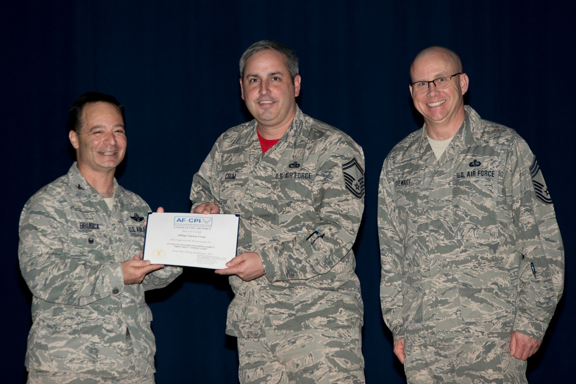 U.S. Air Force Reserve Col. Anthony Brusca, interim commander for the 913th Airlift Group, Senior Master Sgt. Clayton Crum, 96th Aerial Port Squadron and Chief Master Sgt. Paul Stewart, superintendent, 913 AG, pose for a photo during Commander’s Call Feb. 12, 2017, at Little Rock Air Force Base, Ark. Crum was recognized for receiving his certification as an Air Force Continuous Process Improvement Green Belt. (Courtesy photo by Eva Walston /Released)