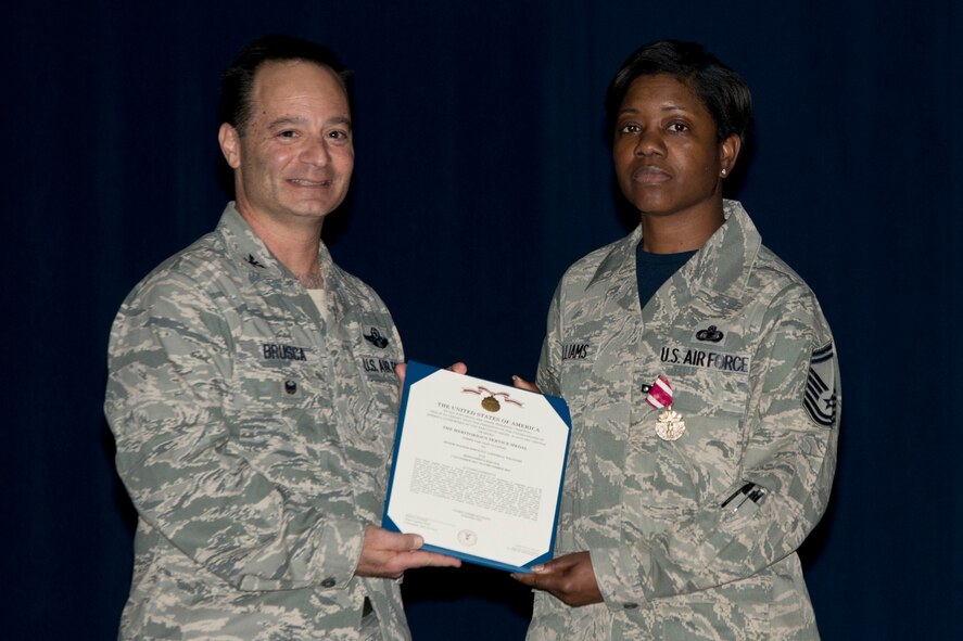 U.S. Air Force Reserve Col. Anthony Brusca, interim commander for the 913th Airlift Group and Senior Master Sgt. Takesha Williams, 913th Airlift Group Staff, pose for a photo during the Group Commander’s Call Feb. 12, 2017, at Little Rock Air Force Base, Ark. Williams was awarded the Meritorious Service Medal for outstanding service as First Sergeant for the 913 AG from 1 November 2011 to 6 December 2015. (U.S. Air Force photo by Master Sgt. Jeff Walston/Released)