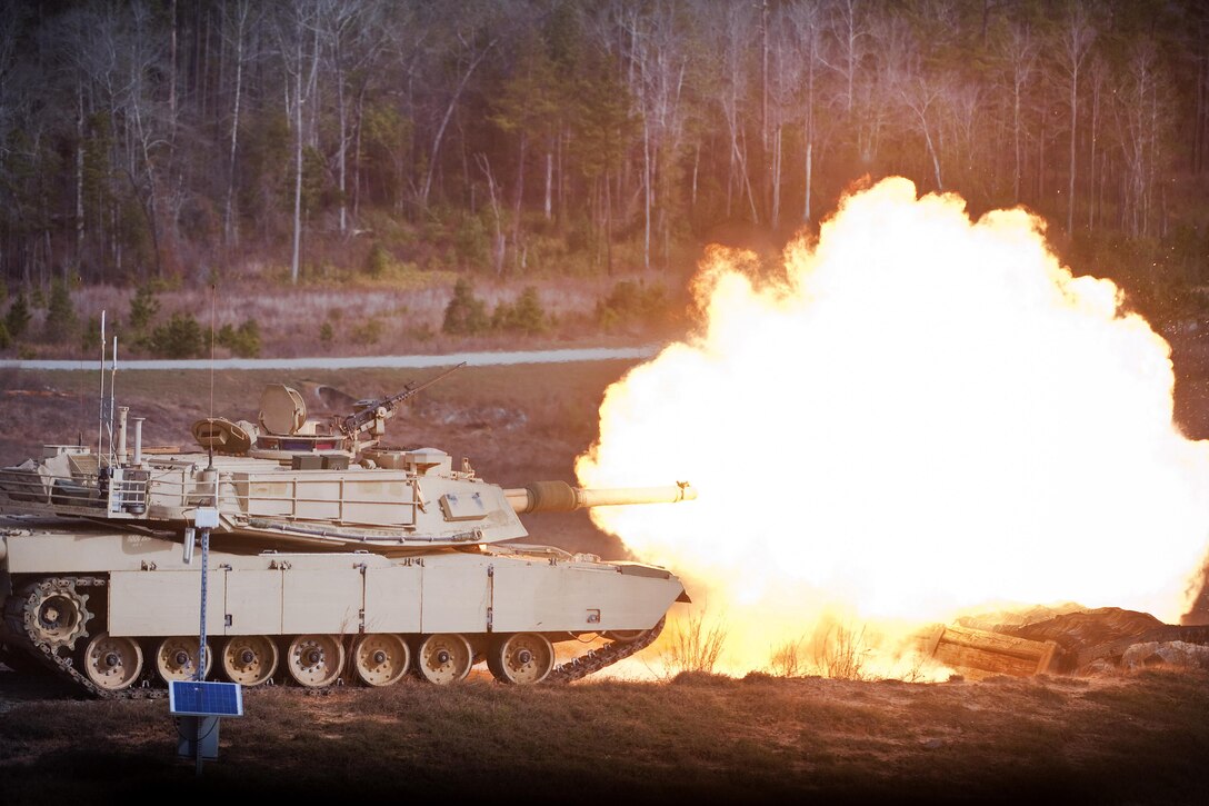 Inside an Abrams battle tank, Army armor basic officer students fire its main gun at stationary light-armored targets during tank live-fire training at Fort Benning, Ga., Feb. 9, 2017. Army photo by Patrick A. Albright