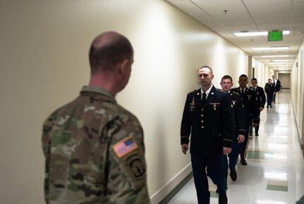 Competitors make their way towards the interview board portion of the 301st Maneuver Enhancement Brigade Best Warrior competition, at Joint Base Lewis-McChord, Washington, February 9, 2017. Best Warrior is an annual competition designed to test each soldier’s physical and mental fitness, proficiency in warrior tasks, resiliency, and their determination to be the best (U.S. Army Reserve Photo by Spc. Sean Harding/Released).