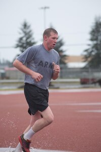 Spc. Christopher R. Williams, Headquarters and Headquarters company, 301st Maneuver Enhancement Brigade, races towards the finish line of the 2-mile run portion of the Army Physical Fitness Test, during the 301st Maneuver Enhancement Brigade Best Warrior Competition, at Joint-Base Lewis-McChord, Washington, February 9, 2017. Best Warrior is an annual competition designed to test each soldier’s physical and mental fitness, proficiency in warrior tasks, resiliency, and their determination to be the best (U.S. Army Reserve photo by Sgt. Demetrio Montoya/Released).