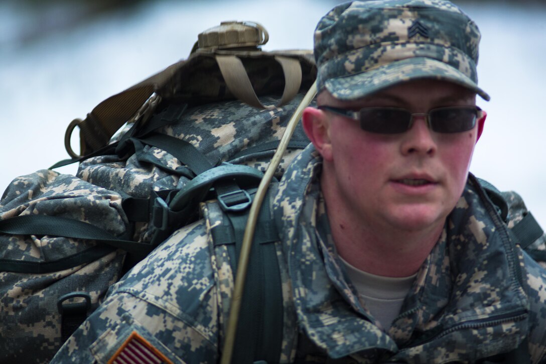 Sgt. Jonathan D. Lancaster of the 321st Engineer Battalion moves forward quickly during the ruck march portion of the 301st Maneuver Enhancement Brigade Best Warrior competition, at Joint Base Lewis-McChord, Washington, February 8, 2017. Best Warrior is an annual competition held at various levels throughout the Army to determine who will compete in the Department of the Army Best Warrior competition at Fort A.P. Hill, Virginia (U.S. Army Reserve Photo by Sgt. Demetrio Montoya/Released).