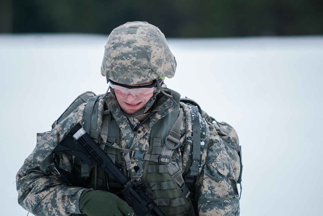 Spc. Heath B. Edin, 476th Chemical Battalion, moves between distances at the known distance range portion of the 301st Maneuver Enhancement Brigade Best Warrior competition, at Joint Base Lewis-McChord, Washington, February 7, 2017. Best Warrior is an annual competition held at various levels throughout the Army to determine who will compete in the Department of the Army Best Warrior competition at Fort A.P. Hill, Virginia (U.S. Army Reserve Photo by Spc. Sean Harding/Released).