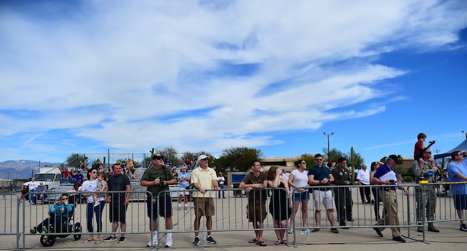 Spectators of the 2017 Heritage Flight Training and Certification Course watch as aircraft perform at Davis-Monthan Air Force Base, Ariz., Feb. 11, 2017. The crowd watched as older and newer generation aircraft performed and qualified for the upcoming year’s air shows. (U.S. Air Force photo by Senior Airman Kimberly Nagle)