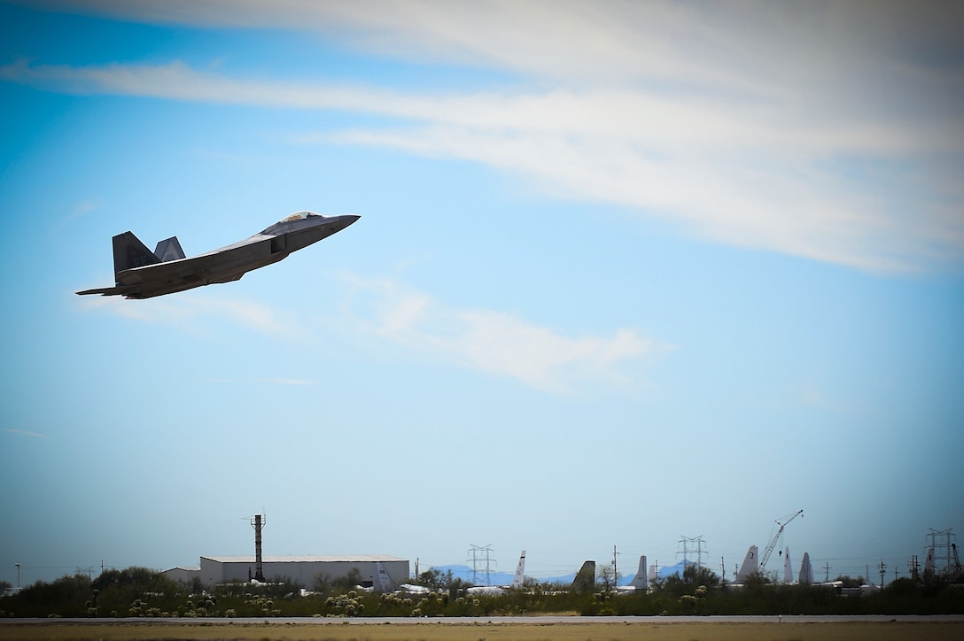 An F-22 Raptor takes-off during the 2017 Heritage Flight Training and Certification Course at Davis-Monthan Air Force Base, Ariz., Feb. 11, 2017. During the course, the F-22 Raptor took to the skies with new generation and older generation aircraft, including the F-35 Lightning and the P-51 Mustang. (U.S. Air Force photo by Senior Airman Kimberly Nagle)