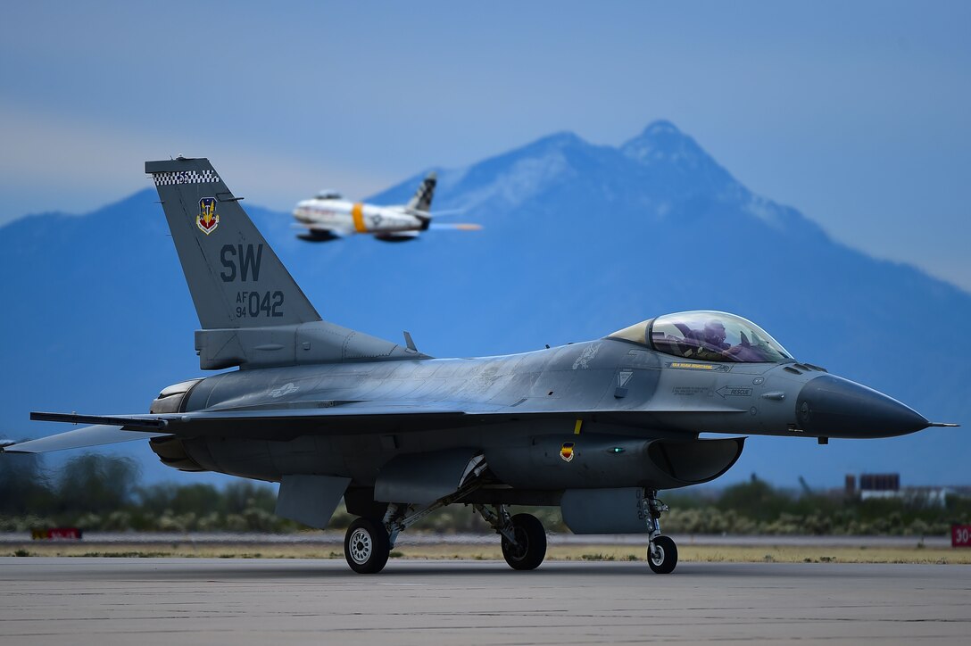 An F-16 Viper completes a flight during the 2017 Heritage Flight Training and Certification Course at Davis-Monthan Air Force Base, Ariz., Feb 12, 2017. During its time at the course, the F-16 flew with additional aircraft, such as the P-51 Mustang and A-10C Thunderbolt II. (U.S. Air Force photo by Senior Airman Kimberly Nagle)  