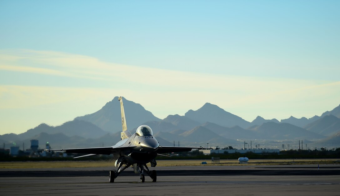 An F-16 Viper taxies after flying during the 2017 Heritage Flight Training and Certification Course at Davis-Monthan Air Force Base, Ariz., Feb. 11, 2017. The F-16 Viper was joined by several aircraft, including the F-22 Raptor, F-35 Lightning II and the A-10C Thunderbolt II during the 20th annual demonstration training. (U.S. Air Force Photo by Senior Airman Kimberly Nagle)  