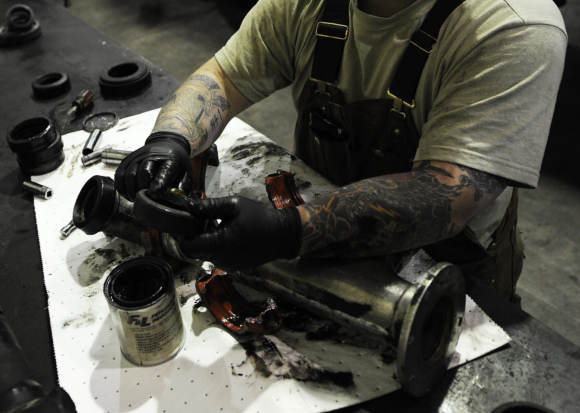 Senior Airman Broderick Laflen, 5th Logistics Readiness Squadron fire truck and refueling mechanic, replaces seals on a pipe from a C301 refueling truck at Minot Air Force Base, N.D., Feb. 8, 2017. The 5th LRS team determines serviceability, overall condition of the trucks, and need for repair by diagnostic, visual and audio examinations. (U.S. Air Force photo/Senior Airman Kristoffer Kaubisch)