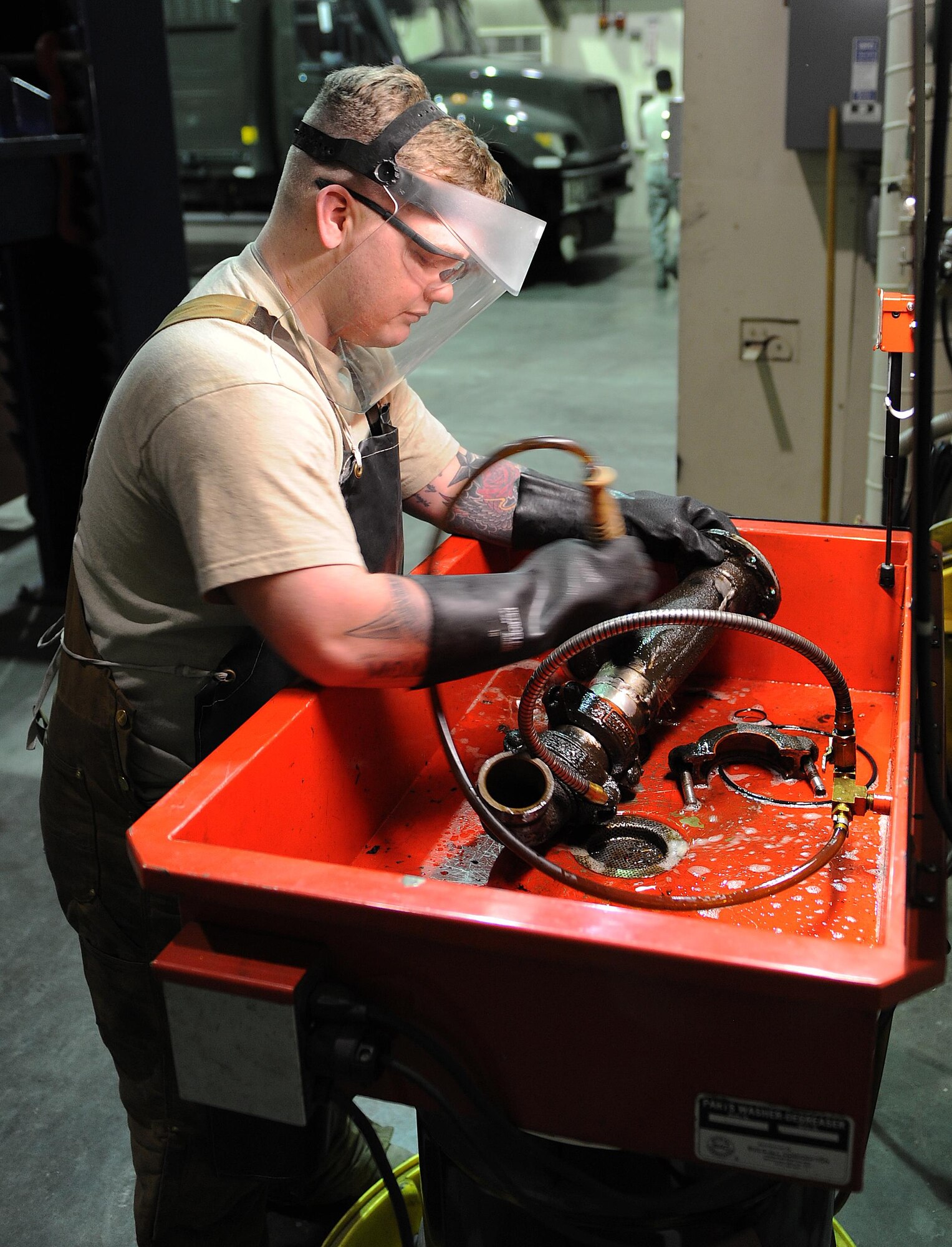 Senior Airman Broderick Laflen, 5th Logistics Readiness Squadron fire truck and refueling mechanic, washes a part from a C301 refueling truck at Minot Air Force Base, N.D., Feb. 8, 2017. The 5th LRS team performs scheduled, unscheduled and preventative maintenance so base operations can continue to run smoothly. (U.S. Air Force photo/Senior Airman Kristoffer Kaubisch)