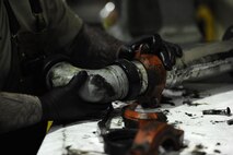 Senior Airman Broderick Laflen, 5th Logistics Readiness Squadron fire truck and refueling mechanic, replaces seals on a pipe from a C301 refueling truck at Minot Air Force Base, N.D., Feb. 8, 2017. The 5th LRS team determines serviceability, overall condition of the trucks, and need for repair by diagnostic, visual and audio examinations. (U.S. Air Force photo/Senior Airman Kristoffer Kaubisch)