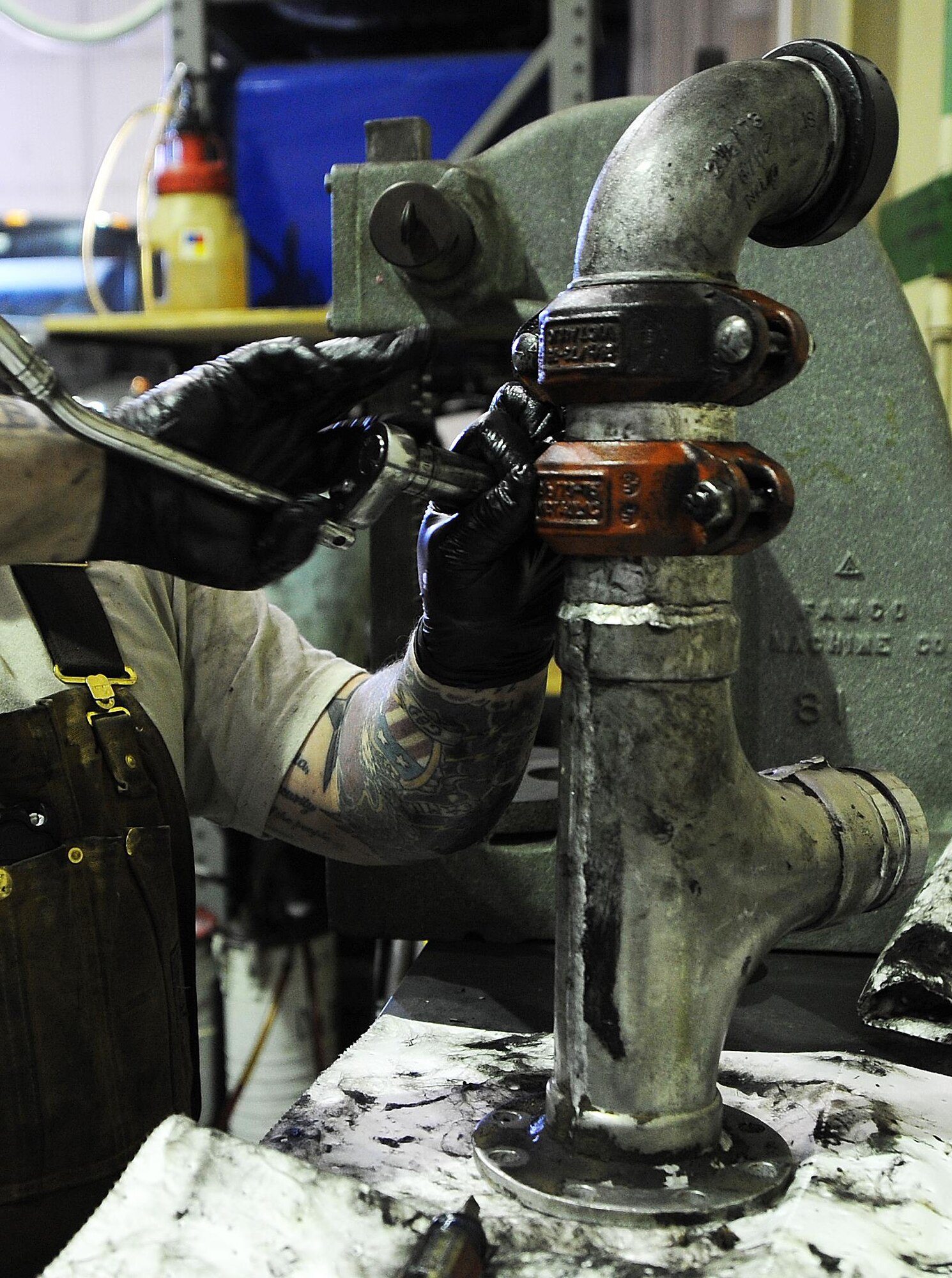 Senior Airman Broderick Laflen, 5th Logistics Readiness Squadron fire truck and refueling mechanic, replaces seals on a pipe from a C301 refueling truck at Minot Air Force Base, N.D., Feb. 8, 2017. The 5th LRS team determines serviceability, overall condition of the trucks, and need for repair by diagnostic, visual and audio examinations. (U.S. Air Force photo/Senior Airman Kristoffer Kaubisch)