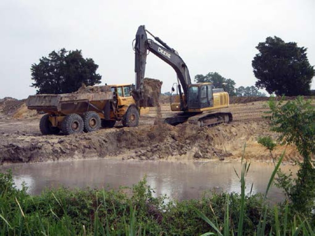Truck and excavator conducting earthwork