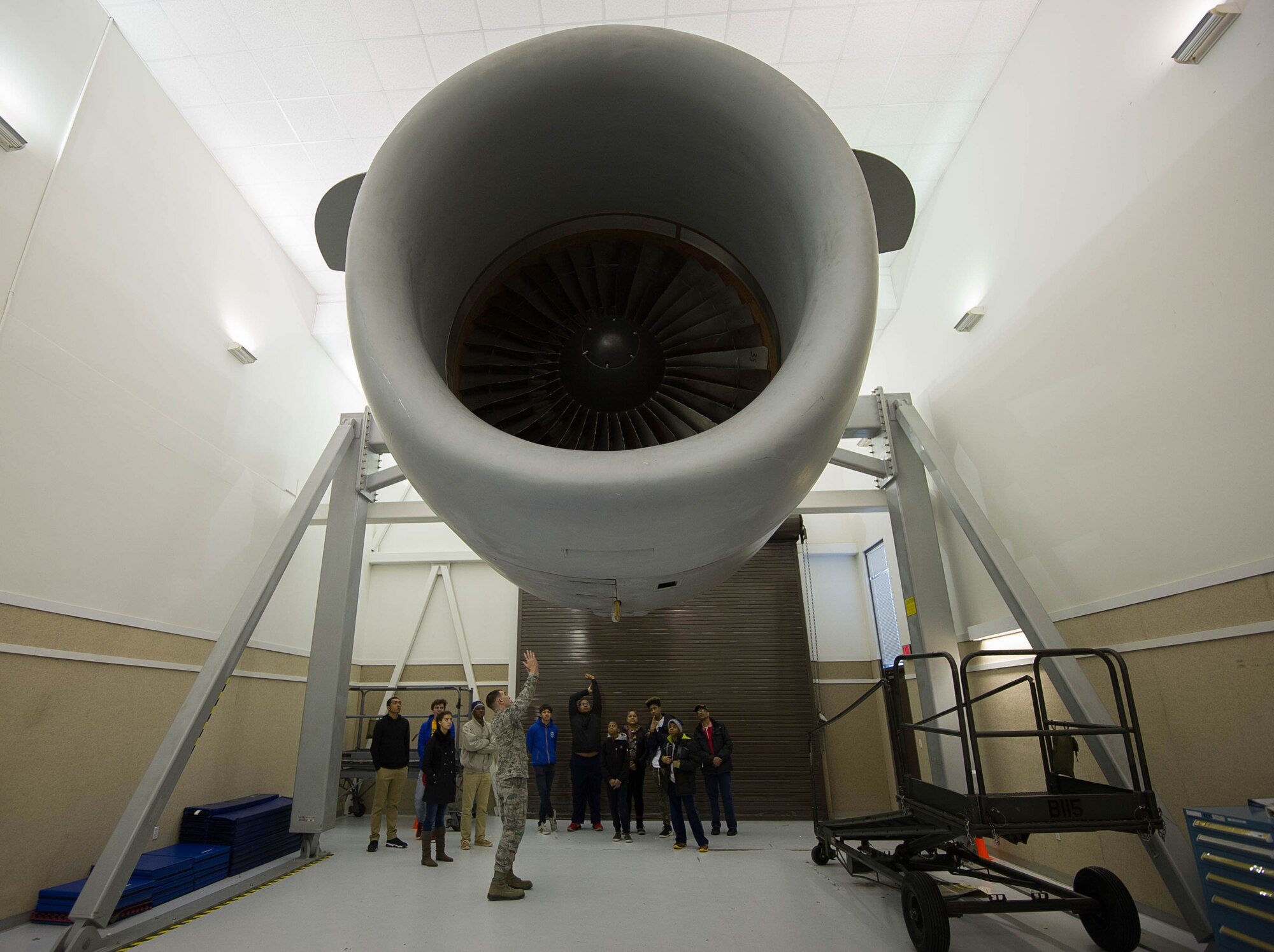 Tech. Sgt. Nathan Gardner discusses a C-17 Globemaster III engine with students from the Red-Tailed Hawks FlyingvFeb. 11, 2017, on Joint Base Lewis-McChord, Wash. Gardener is an instructor with the 373rd Training Squadron, Detachment 12, whose parent unit is located at Sheppard Air Force Base, Witchita Falls, Texas. (U.S. Air Force photo by David L. Yost)