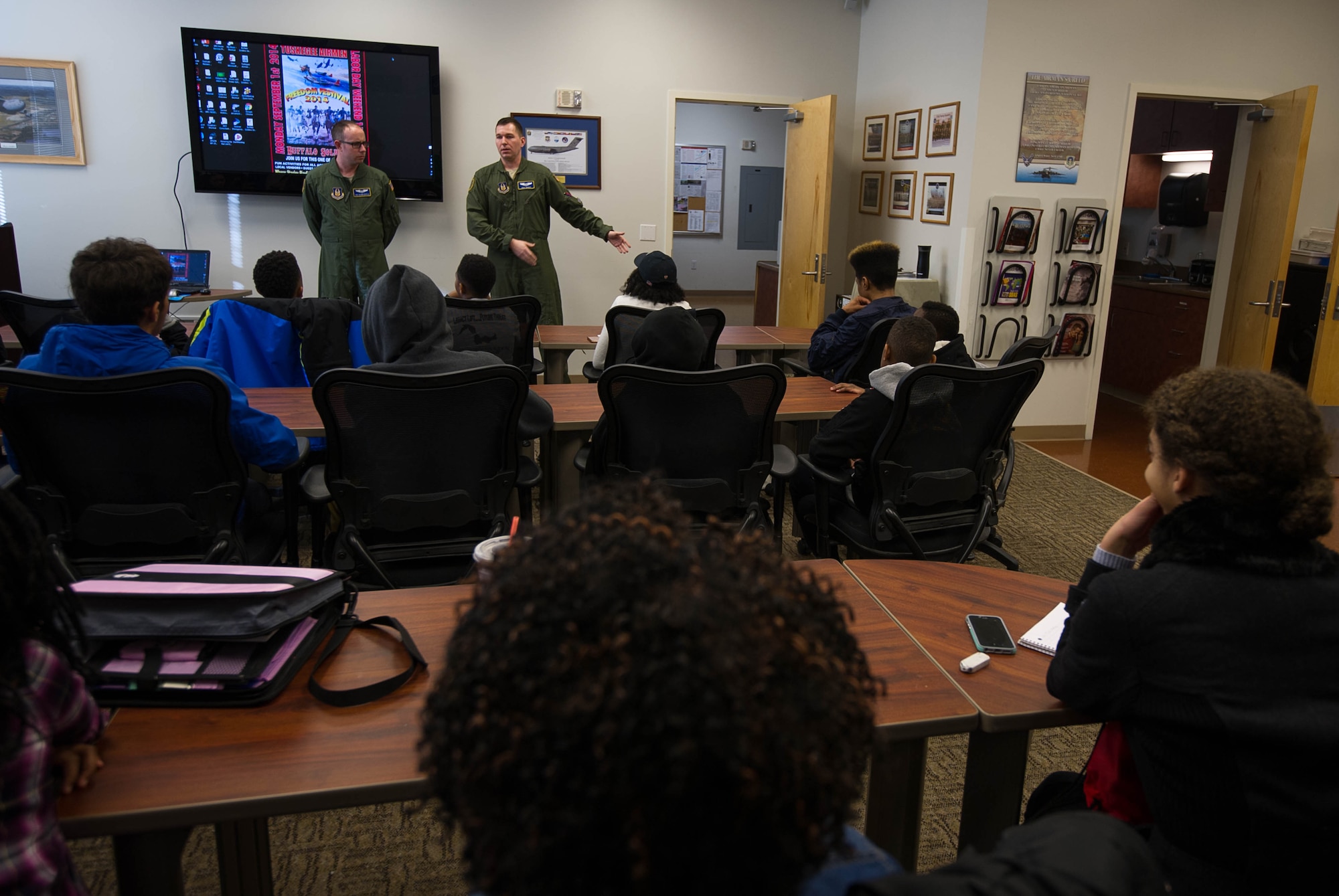 1Lt. Shay Dennis and SrA Glenn Bartle speak about their aviation career fields to members of the Red-Tailed Hawks Flying Club Feb. 11, 2017, on Joint Base Lewis-McChord, Wash. Dennis and Bartle are assigned to the 446th Airlift Wing. (U.S. Air Force photo by David L. Yost)