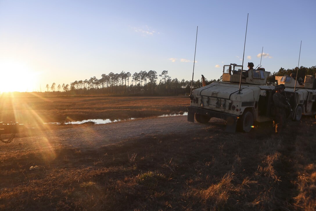 Marines return back to their forward operating base after mounted and dismounted patrols at Camp Lejeune, N.C., Feb. 9, 2017. Marines took part in a monthly field exercise where they practiced company-level operations as well as tactical site exploitation and detainee operations. The Marines are with Law Enforcement Battalion, II Marine Expeditionary Force Headquarters Group. (U.S. Marine Corps photo by Lance Cpl. Miranda Faughn)