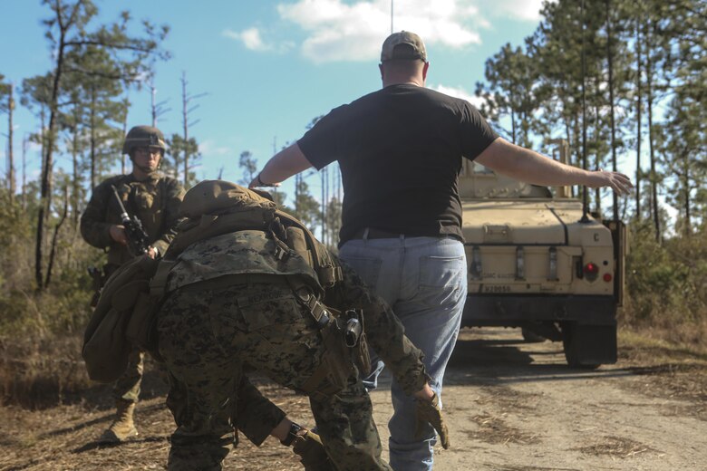 Sgt. Chad Rexrode pats down a suspect during a during a notional detainee operation at Camp Lejeune, N.C., Feb. 9, 2017. During a monthly field exercise, Marines practiced questioning suspects and detaining who they deemed harmful. This exercise is to help them practice skill sets they might use in deployed environments. Rexrode is with Law Enforcement Battalion, II Marine Expeditionary Force Headquarters Group. (U.S. Marine Corps photo by Lance Cpl. Miranda Faughn)