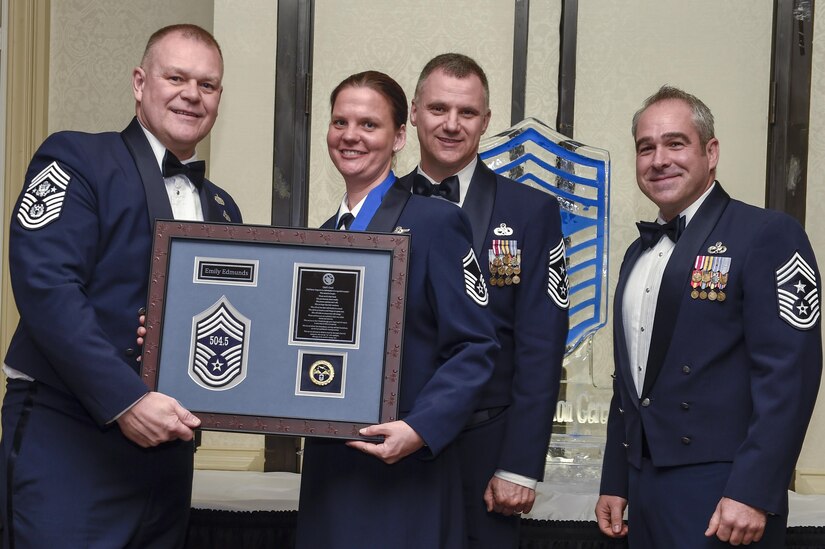 From left to right: retired Chief Master Sgt. James Roy,16th Chief Master Sergeant of the Air Force, recognizes Chief Master Sgt. Emily Edmunds, 437th Operations Support Squadron superintendent, along with Chief Master Sgt. Mark Barber, 315th Airlift Wing command chief, and Chief Master Sgt. Kristopher K. Berg, 437th Airlift Wing command chief, during the chief master sergeant recognition ceremony at the Charleston Club Feb. 11, 2017. Chief master sergeant is the highest enlisted rank in the Air Force held by one percent of the enlisted force.  