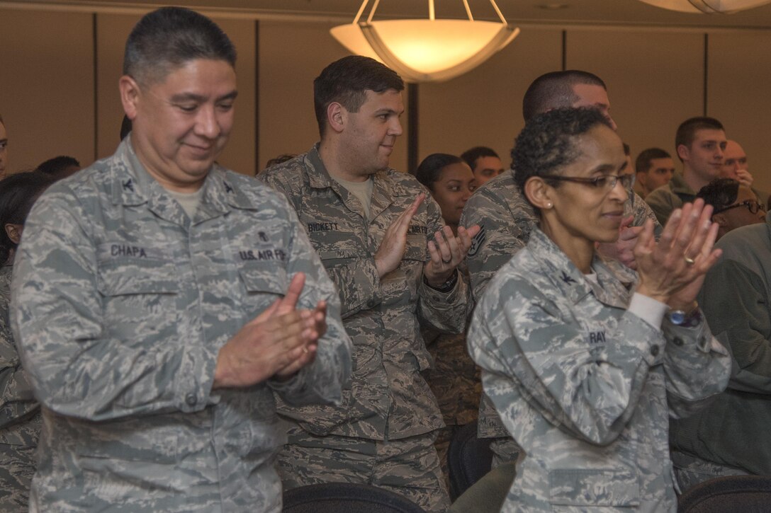 The audience applauds Maj. Gen Roosevelt Allen, Office of the Surgeon General medical operations, research director and chief of the dental corps, during a speech about Black History Month at Joint Base Andrews, Md., Feb. 10, 2017. In 1986, February was designated by Congress Public Law 99-244 as a time to learn, honor and celebrate the achievements of African Americans throughout history. (U.S. Air Force photo by Airman 1st Class Valentina Lopez)