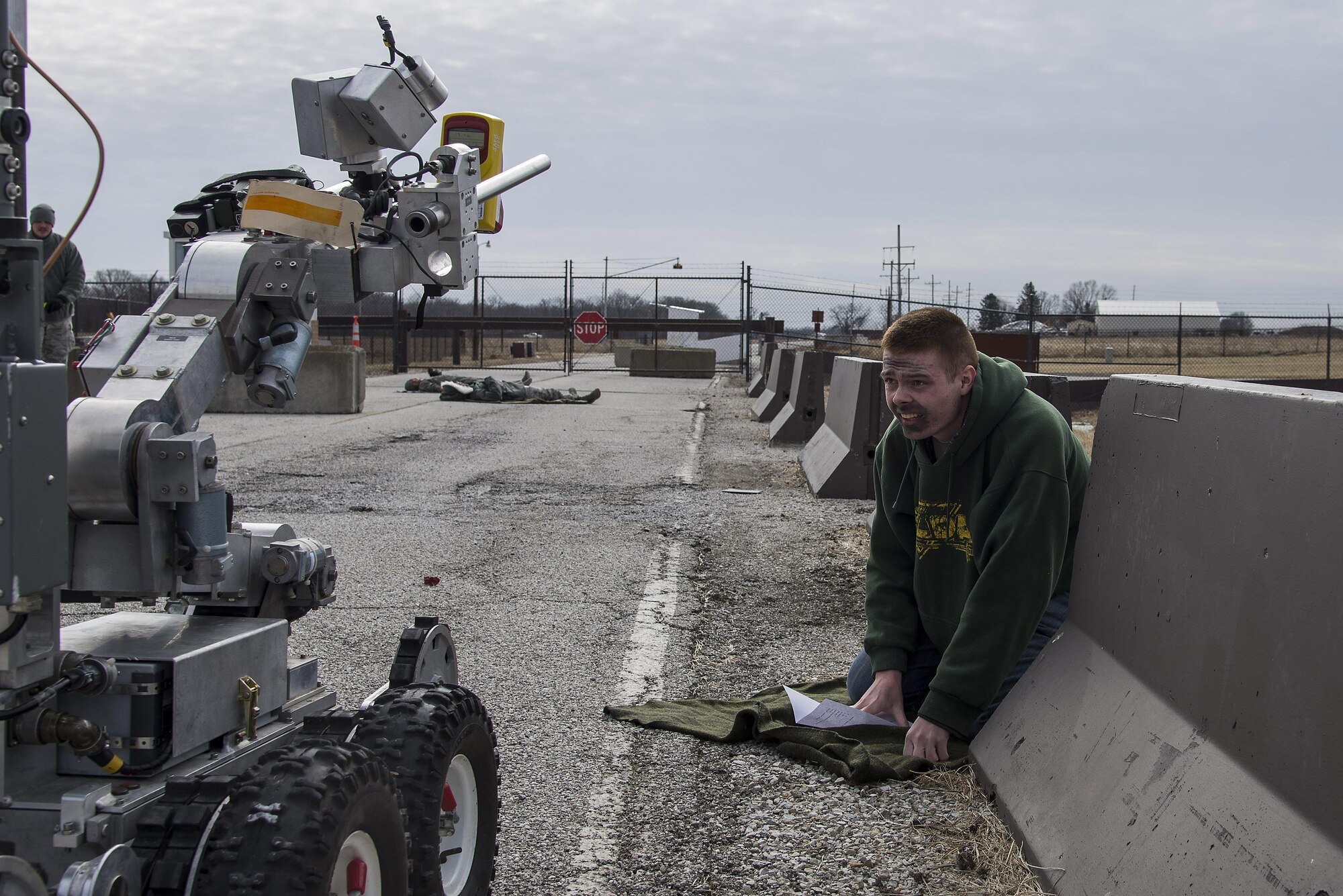 Airman Austin Gorham, 15th Operational Weather Squadron weather forecaster, acts as a victim of an explosion during an exercise at Scott Air Force Base, Illinois, Feb. 9, 2016. This was an exercise to test the Scott's response to an explosion with potential chemical, biological, radiological and nuclear contamination. (U.S. Air Force photo by Airman 1st Class Daniel Garcia)