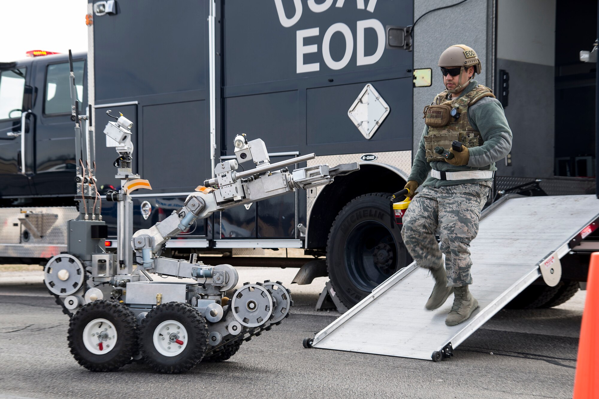 Senior Airman Emilio Solis, 375th Civil Engineer Squadron explosive ordinance disposal apprentice, prepares to attach a Victoreen 451P to the F6A EOD robot for real-time testing of the rate of exposure to radioactive material during an exercise at Scott Air Force Base, Illinois, Feb. 9, 2016. This was an exercise to test the bases's response to an explosion with potential chemical, biological, radiological and nuclear contamination. (U.S. Air Force photo by Airman 1st Class Daniel Garcia)