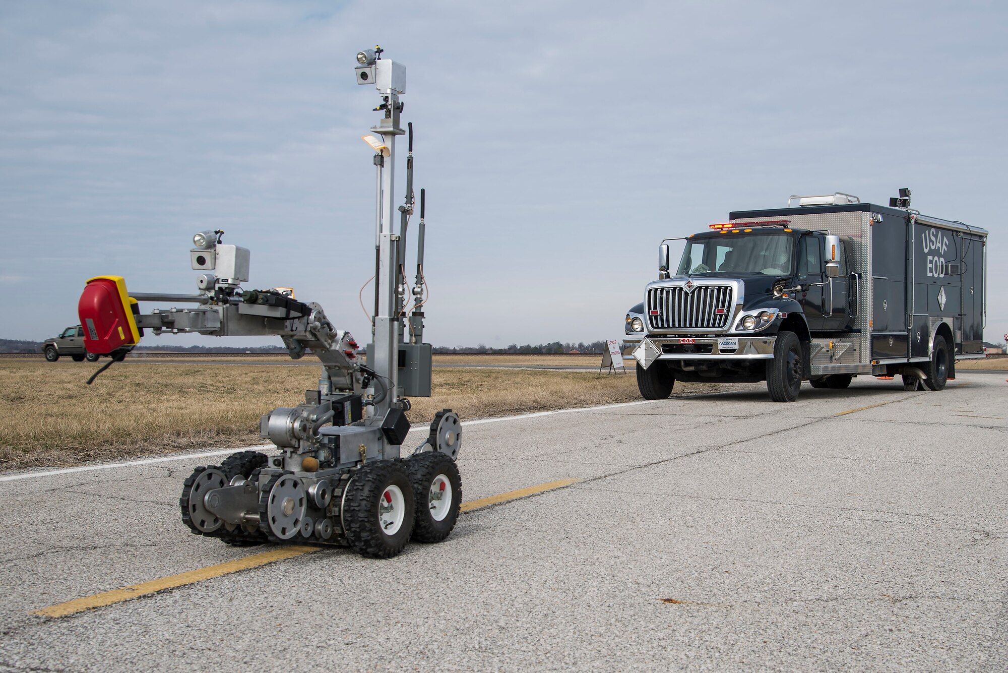 The 375th Civil Engineering Squadron's F6A explosive ordinance disposal robot makes its way towards the scene of an explosion during an exercise at Scott Air Force Base, Illinois, Feb. 9, 2016. This was an exercise to test Scott's response to an explosion with potential chemical, biological, radiological and nuclear contamination. (U.S. Air Force photo by Airman 1st Class Daniel Garcia)