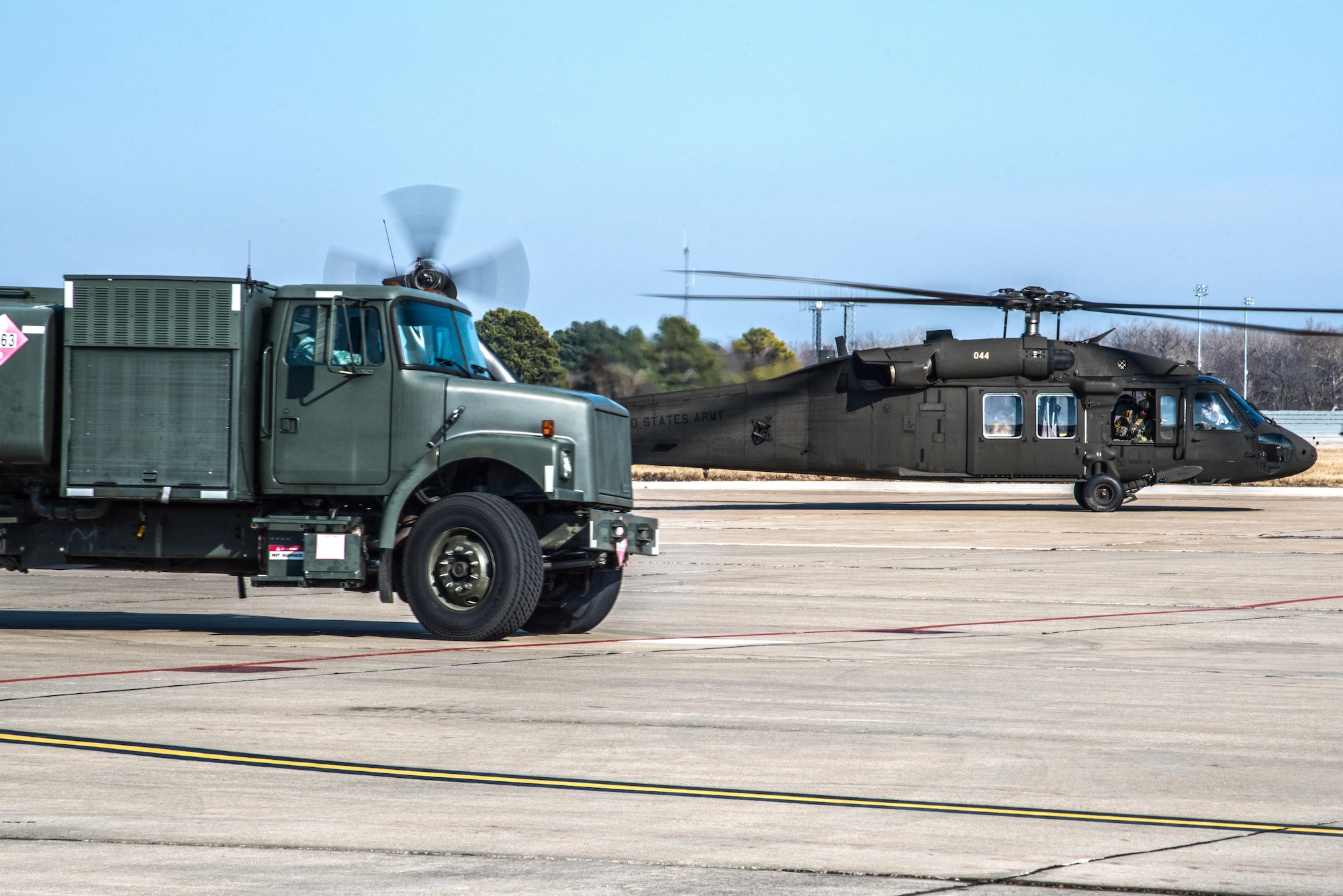 Scott Air Force Base Airmen recently received training for "hot refueling". The training provides aircrews with procedures specific to "hot refueling" operations, with the helicopter running while refueling, versus "cold refueling" where the helicopter is completely shut down prior to receiving fuel. With this two-person operation, one would concentrate on the fueling portion, such as connecting the bonding cable, deploying the fueling hose, and controlling the fueling while the other would remain in eye sight of both the refueler and a flight crew members. Having the choice to "hot refuel" adds to the readiness of the day to day operations and is highly helpful for practice down range when there's not enough time to shut down to refuel. (U.S. Air Force photos/Senior Airman Tristin English)