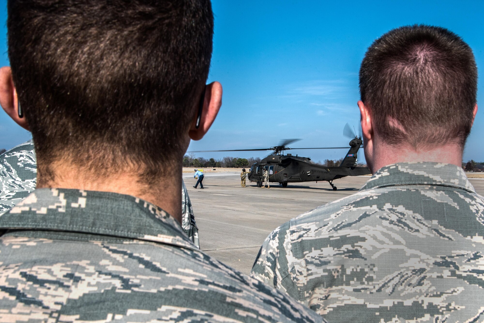 Scott Air Force Base Airmen recently received training for "hot refueling". The training provides aircrews with procedures specific to "hot refueling" operations, with the helicopter running while refueling, versus "cold refueling" where the helicopter is completely shut down prior to receiving fuel. With this two-person operation, one would concentrate on the fueling portion, such as connecting the bonding cable, deploying the fueling hose, and controlling the fueling while the other would remain in eye sight of both the refueler and a flight crew members. Having the choice to "hot refuel" adds to the readiness of the day to day operations and is highly helpful for practice down range when there's not enough time to shut down to refuel. (U.S. Air Force photos/Senior Airman Tristin English)