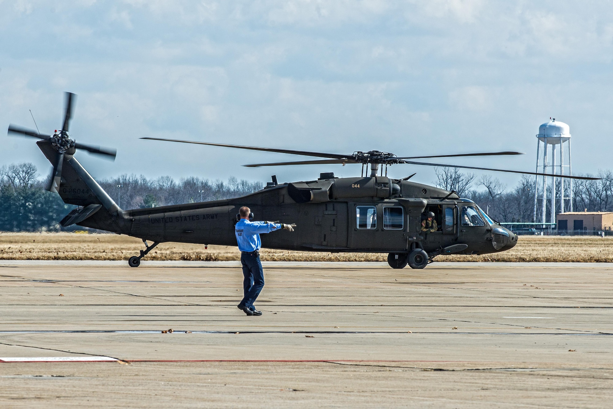 Scott Air Force Base Airmen recently received training for "hot refueling". The training provides aircrews with procedures specific to "hot refueling" operations, with the helicopter running while refueling, versus "cold refueling" where the helicopter is completely shut down prior to receiving fuel. With this two-person operation, one would concentrate on the fueling portion, such as connecting the bonding cable, deploying the fueling hose, and controlling the fueling while the other would remain in eye sight of both the refueler and a flight crew members. Having the choice to "hot refuel" adds to the readiness of the day to day operations and is highly helpful for practice down range when there's not enough time to shut down to refuel. (U.S. Air Force photos/Senior Airman Tristin English)