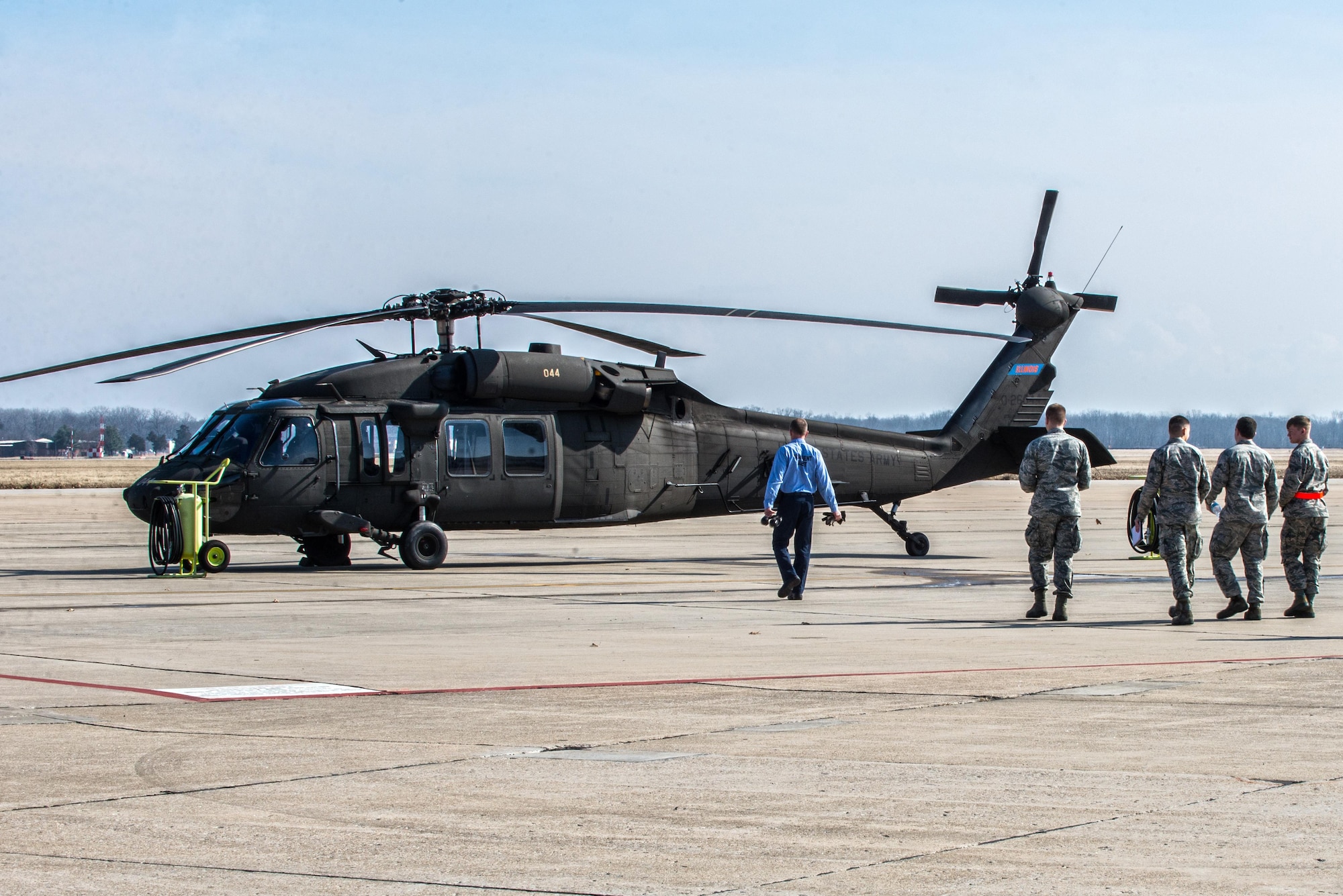 Scott Air Force Base Airmen recently received training for "hot refueling". The training provides aircrews with procedures specific to "hot refueling" operations, with the helicopter running while refueling, versus "cold refueling" where the helicopter is completely shut down prior to receiving fuel. With this two-person operation, one would concentrate on the fueling portion, such as connecting the bonding cable, deploying the fueling hose, and controlling the fueling while the other would remain in eye sight of both the refueler and a flight crew members. Having the choice to "hot refuel" adds to the readiness of the day to day operations and is highly helpful for practice down range when there's not enough time to shut down to refuel. (U.S. Air Force photos/Senior Airman Tristin English)