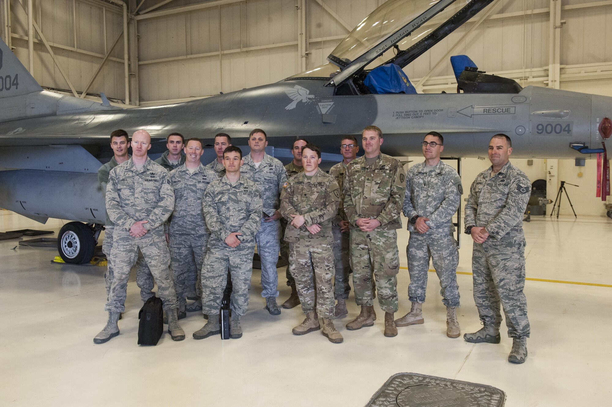 Explosive Ordnance Disposal team members, assigned to the 734th Explosive Ordnance Company EOD at Fort Bliss, Texas and the 49th Civil Engineer Squadron EOD flight pose for a picture at Holloman Air Force Base, N.M. Feb. 14, 2017. The two teams participated in joint training in which the 49th EOD team taught the 734th EOD team pinning procedures on an F-16 Fighting Falcon. (U.S. Air Force photo by Airman Ilyana A. Escalona)