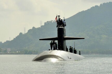 SEPANGAR, Malaysia (April. 3, 2012) Los Angeles-class fast attack submarine USS Louisville (SSN 724) sails into Sepangar Bay to conduct a coordinated tended mooring and theater security cooperation port visit with submarine tender USS Emory S. Land (AS 39). Louisville, homeported in Pearl Harbor, Hawaii, is currently on a Western Pacific deployment, while Land is on an extended deployment to Guam serving as 7th Fleet’s lead afloat fleet maintenance activity from the ship’s permanent home port of Diego Garcia. (U.S. Navy photo by Mass Communication Specialist 1st Class David R. Krigbaum/ released)