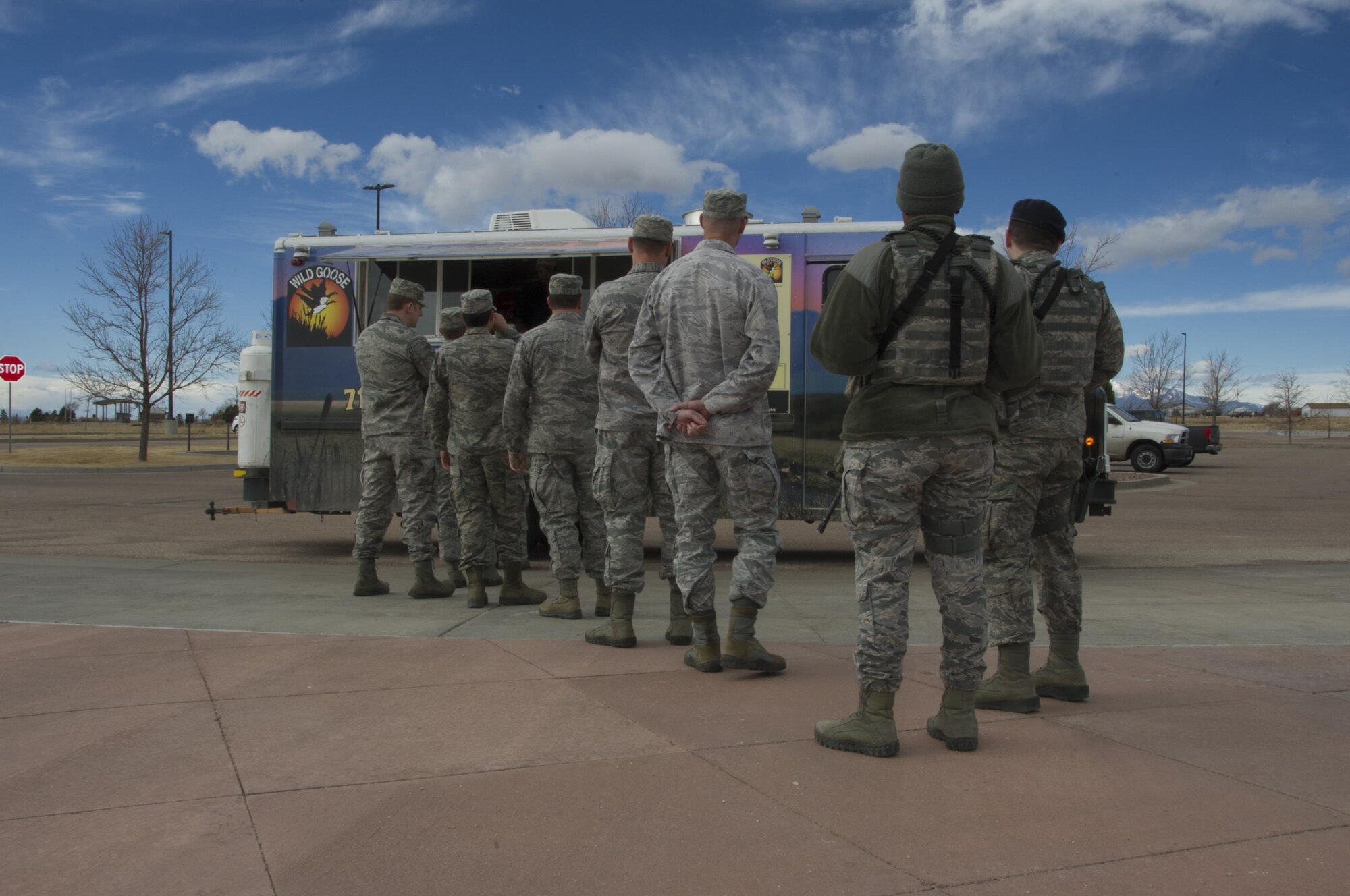 SCHRIEVER AIR FORCE BASE, Colo. -- Members of the 310th Space Wing stand in line waiting to order their lunch during the Unit Training Assembly on Saturday, Feb. 11th, 2017. With limited food options on Schriever during UTA weekends, the willingness of vendors to provide meal options for Reservists strengthened morale among members of the 310th. (U.S. Air Force photo/Staff Sgt. Chris Moore)