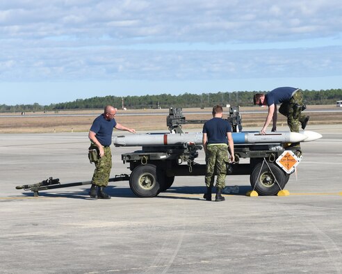 Royal Canadian Air Force weapons systems specialists from the 401st Tactical Fighter Squadron prep training weapons for use during the Weapons Systems Evaluation Program held at Tyndall Air Force Base, Fla., Jan. 31, 2017. The Canadians took part in the exercises Combat Archer and Combat Hammer to test their effectiveness with various weapons tactics and systems. (U.S. Air Force photo by Airman 1st Class Cody R. Miller/Released)