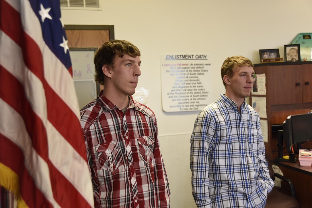 Twin brothers, Logan and Whitley Barr, enlists into the 114th Aircraft Maintenance Squadron phase shop Feb. 14, 2017 Sioux Falls, S.D. The Barr brothers are the first enlistees to join the 114th Fighter Wing since the Air National Guard brought back the signing bonus which applies to select career fields. (U.S. Air National Guard photo by Staff Sgt. Duane Duimstra/Released)