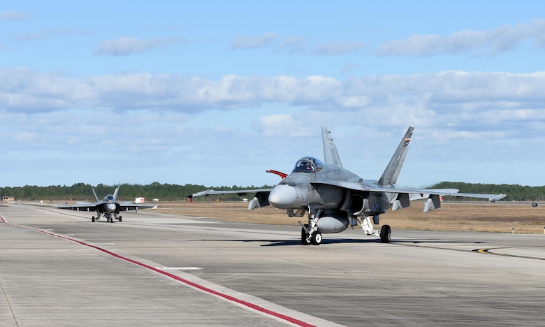 Royal Canadian Air Force CF-18 Hornets finish their flight after taking part in exercise Combat Archer at Tyndall Air Force Base, Fla., Jan. 31, 2017. Both Combat Archer and Combat Hammer are part of the Weapons Systems Evaluation Program operated by the 53rd Weapons Evaluation Group at Tyndall AFB. The program goal is to evaluate a unit’s capability to employ a variety of weapons systems throughout all stages of the process, from storage and preparation, to use on a target. (U.S. Air Force photo by Airman 1st Class Cody R. Miller/Released)