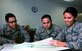 Staff Sgt. Saecho Kao Seng, a 349th Force Support Squadron personnel specialist, aids Airmen 1st Class Justin Ferry and Samantha Bambino, of the 60th Force Support Squadron, in commissioning packages for Airmen assigned to the 349th Air Mobility Wing at Travis Air Force Base, Calif., Feb. 15, 2017. The 60th and 349th FSS units have been working together to become a seamless unit and Total Force Support Squadron in March. (U.S. Air Force photo/Staff Sgt. Daniel Phelps)