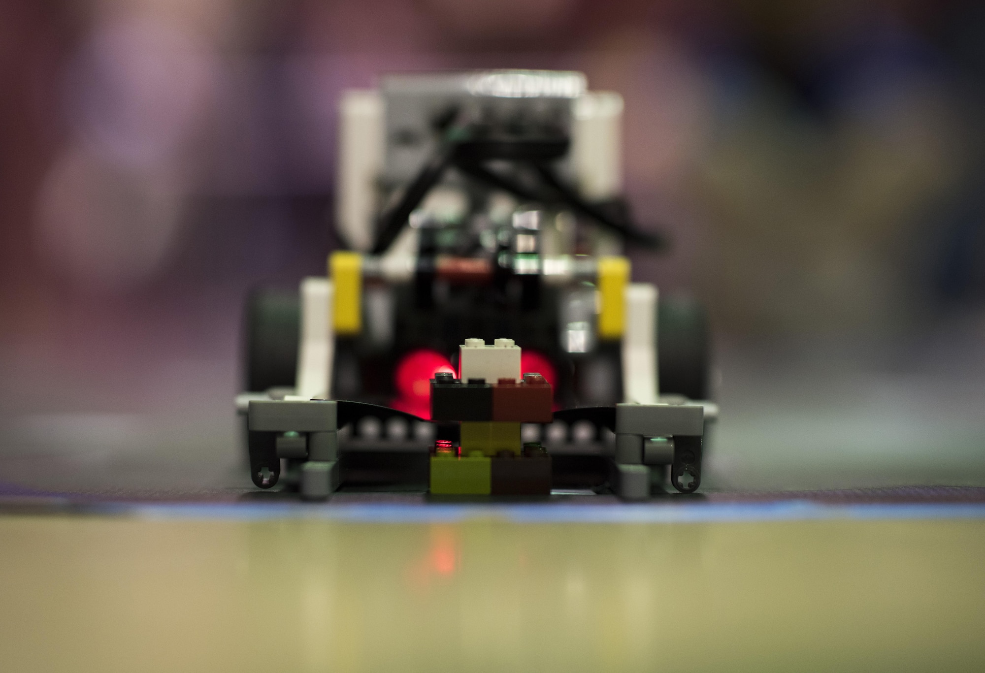 The Barksdale Air Force Base Youth Center’s robot, Cyber Dragoon, places an object on a designated location during the Regional Autonomous Robotics Circuit in Bossier City, La., Feb. 11, 2017. The team’s robot is required to complete a variety of tasks. The challenges require teams to learn about energy resources while exploring a newly discovered, uncharted island with their robots. (U.S. Air Force photo/Senior Airman Damon Kasberg)
