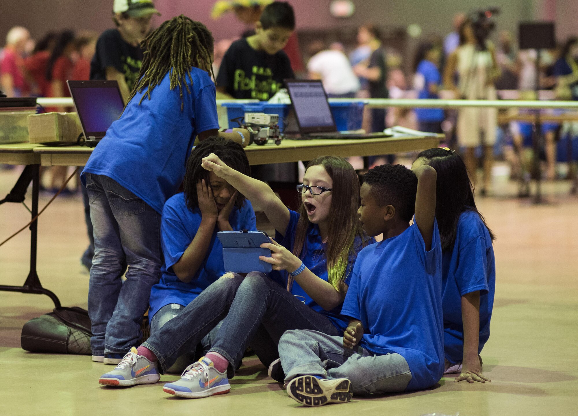 Members of the Barksdale Air Force Base Youth Center robotics team enjoy a break between the first and second rounds of the Regional Autonomous Robotics Circuit in Bossier City, La., Feb. 11, 2017. Hundreds of students from throughout the area participated in the event. (U.S. Air Force photo/Senior Airman Damon Kasberg)