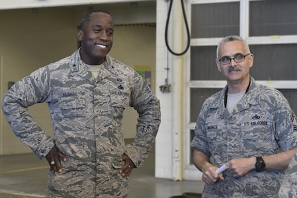 U.S. Air Force Brig. Gen. Stacey T. Hawkins, left, Air Mobility Command Logistics, Engineering and Force Protection director, talks with Senior Master Sgt. Eric McKenzie, right, 437th Maintenance Squadron fabrication flight chief, Feb. 9, 2017, at Joint Base Charleston, South Carolina. Hawkins visited multiple facilities on JB Charleston during his visit to meet with Airmen and senior leaders to discuss operations.