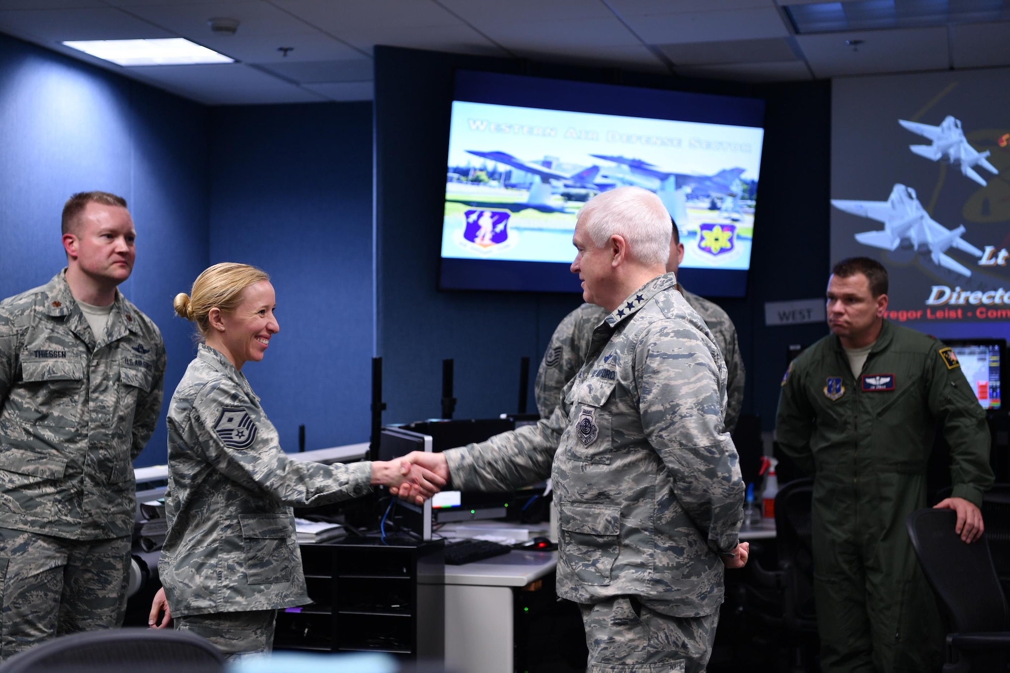 Lt. Gen. L. Scott Rice, Director of the Air National Guard, recognizes 
Master Sgt. Dawn Kloos, 225th Air Defense Group, for recently being named the First Air Force First Sergeant of the Year.  Rice spent the day visiting two Washington Air National Guard units:  the Western Air Defense Sector at Joint Base Lewis-McChord and the 194th Wing at Camp Murray. (U.S. Air Force photo by Kimberly D. Burke)