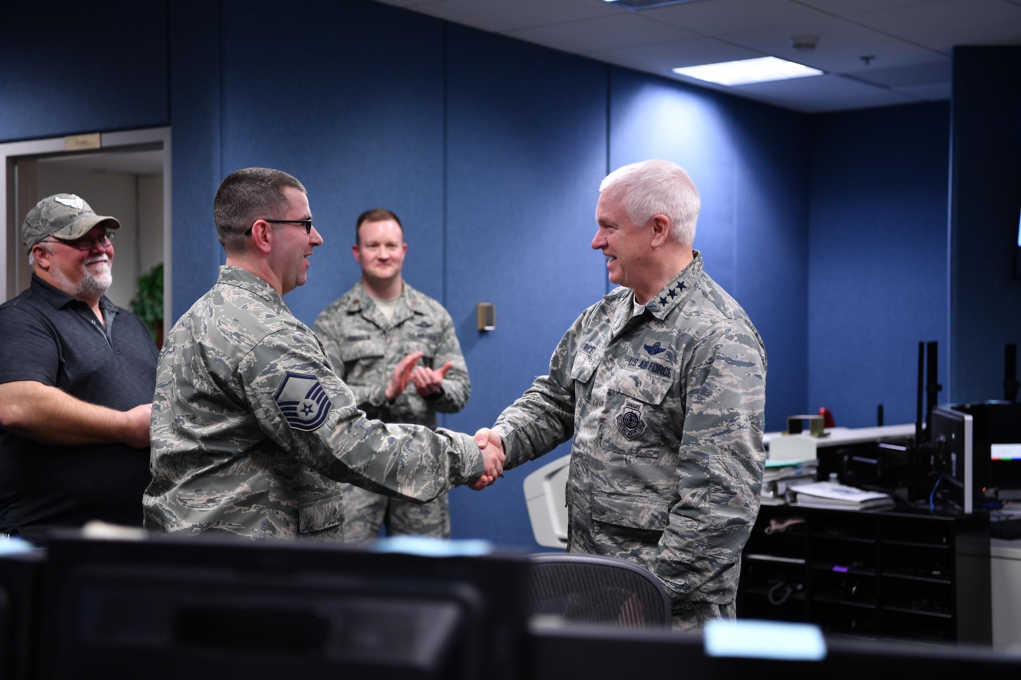 Lt. Gen. L. Scott Rice, Director of the Air National Guard, recognizes 
Master Sgt. Daniel Raile, 225th Support Squadron, for his key contributions to the maintenance and operations of the WADS' power plant.  Rice spent the day visiting two Washington Air National Guard units:  the Western Air Defense Sector at Joint Base Lewis-McChord and the 194th Wing at Camp Murray. (U.S. Air Force photo by Kimberly D. Burke)