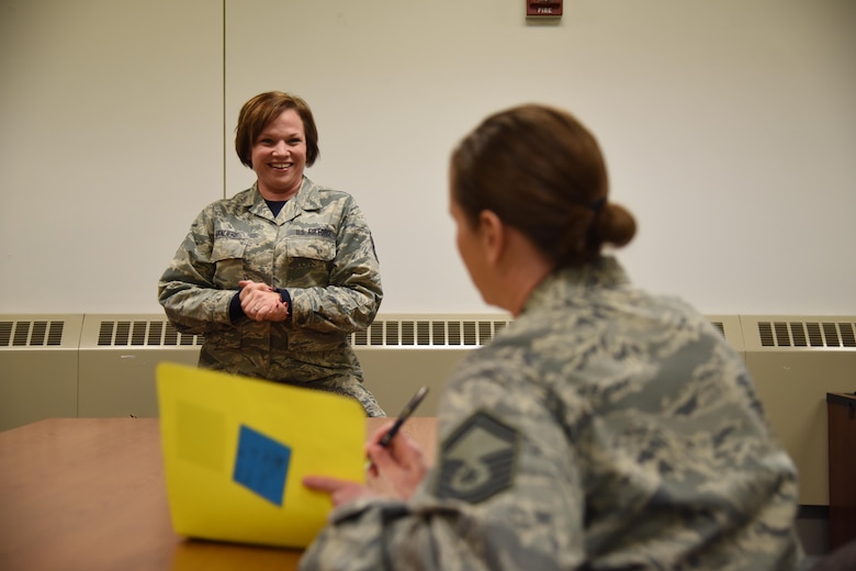 Master Sgt. Bridget VanLiere, 114th Force Support Squadron installation personnel readiness, briefs 114th Fighter Wing Airmen about the upcoming Reserve Component Period (RCP) deployment. Her role is to to ensure all required training and CBTs (computer-based training) are accomplished, member has all required equipment and uniforms, all medical requirements are met and orders are complete in a timely manner. (Air National Guard photo by Staff Sgt. Duane Duimstra/Released)