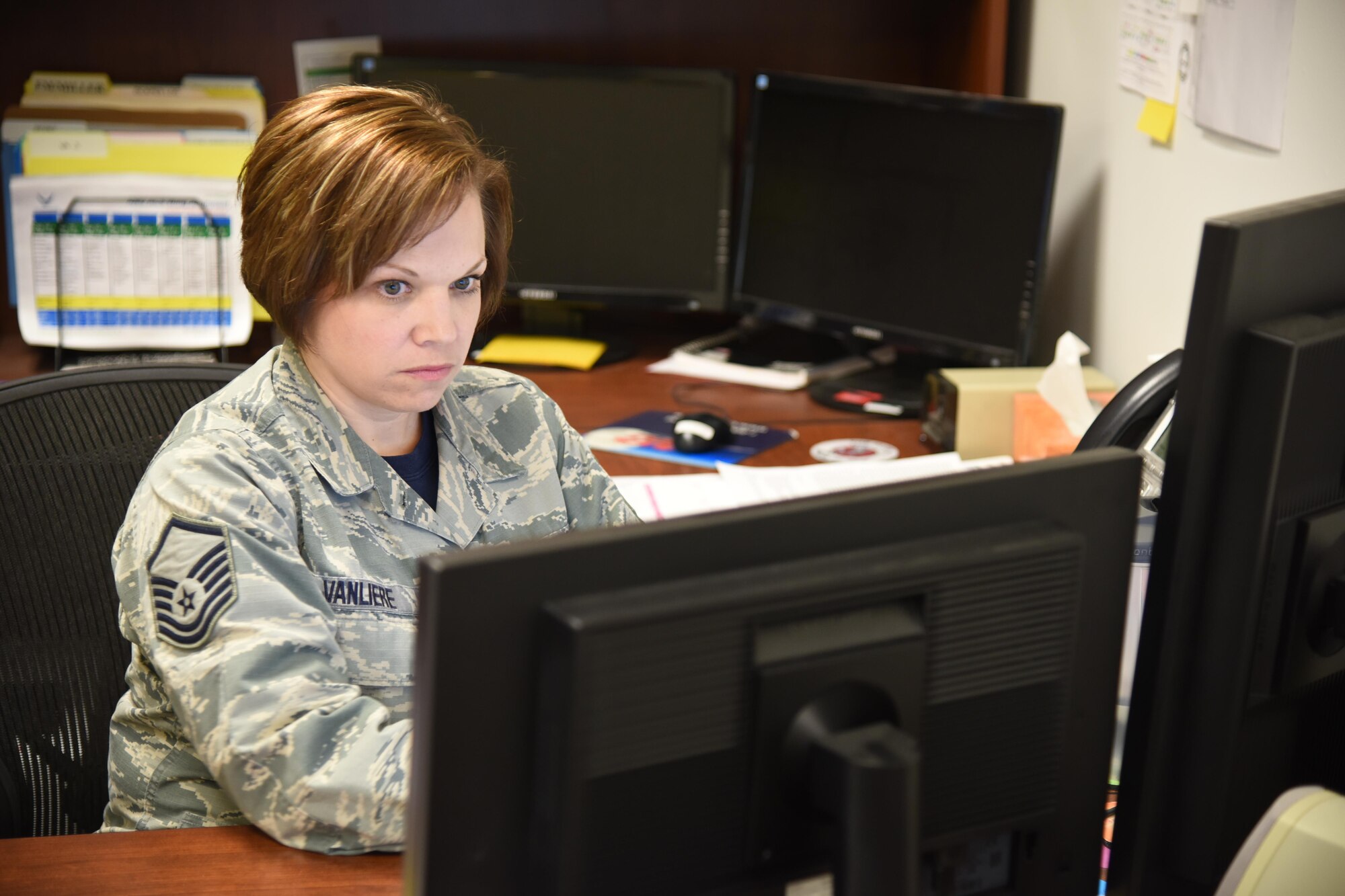 Master Sgt. Bridget VanLiere, 114th Force Support Squadron installation personnel readiness, is the key Airman in the 114th Force Support Squadron that ensures Airmen are prepared for the Reserve Component Period (RCP) deployment and future deployments for the 114th Fighter Wing. Her role is to to ensure all required training and CBTs (computer-based training) are accomplished, member has all required equipment and uniforms, all medical requirements are met and orders are complete in a timely manner. (Air National Guard photo by Staff Sgt. Duane Duimstra/Released)