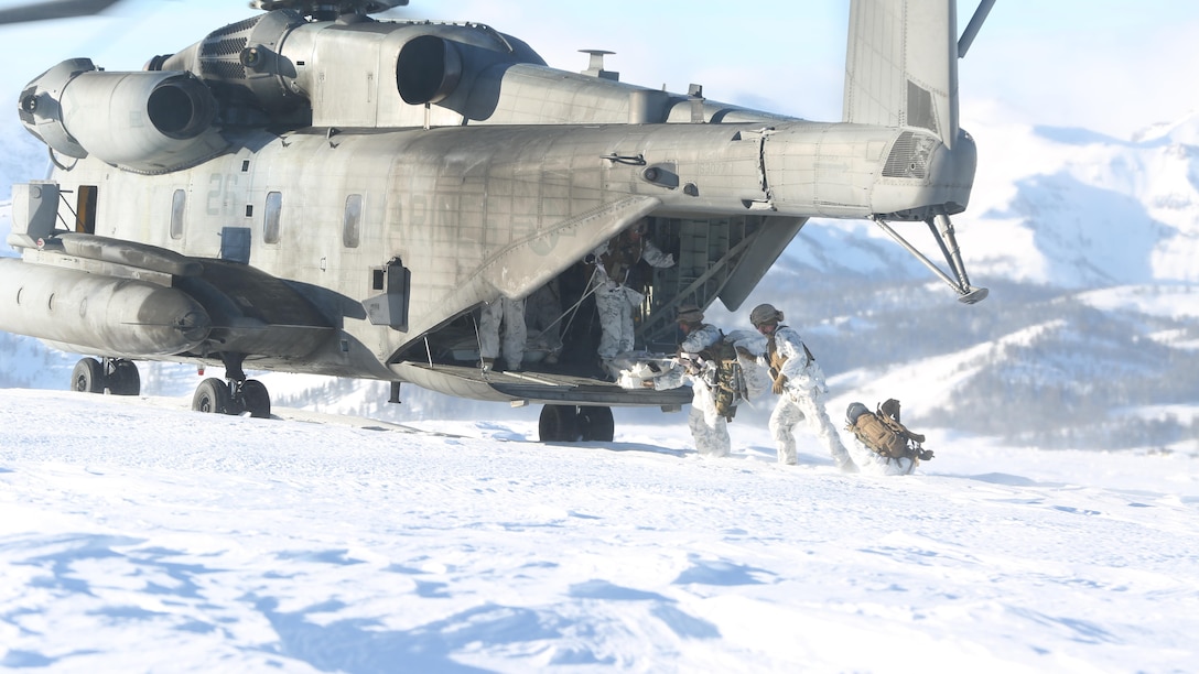 Marines with 2nd Battalion, 2nd Marine Regiment, 2nd Marine Division, begin offloading from a CH-53E Super Stallion with Marine Heavy Helicopter Squadron (HMH) 462 during the insertion drill of their Mountain Exercise training at Marine Corps Mountain Warfare Training Center, Bridgeport, Calif., Feb. 3. On and offload drills also help air crew and pilots refine their tactics, techniques and procedures during real-time training. (U.S. Marine Corps photo by Lance Cpl. Dylan Overbay/RELEASED)