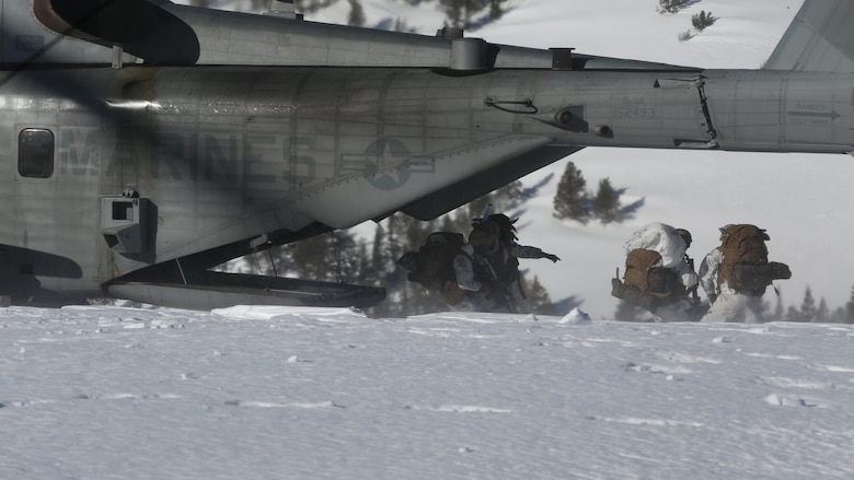Marines with 2nd Battalion, 2nd Marine Regiment, 2nd Marine Division, quickly exit a CH-53E Super Stallion with Marine Heavy Helicopter Squadron (HMH) 462 during on and offloading insertion drills at Marine Corps Mountain Warfare Training Center, Bridgeport, Calif., Feb. 4. Mountain Exercise training is an important function to ensure Marines are prepared to operate in any climate. (U.S. Marine Corps Photo by Lance Cpl. Dylan Overbay/RELEASED)