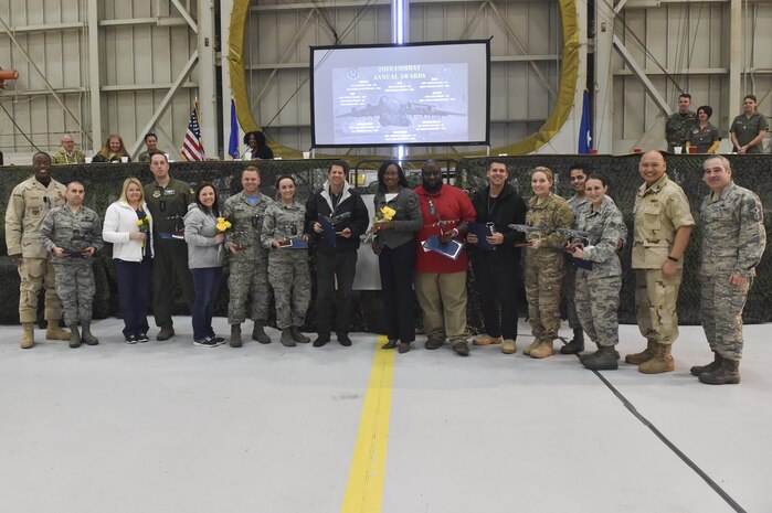 The 437th Airlift Wing annual award winners pose with leadership during the 2016 Combat Annual Awards ceremony at Nose Dock 2, Feb. 10, 2017. These Airmen and civilians were recognized for their dedication and hard work during 2016.