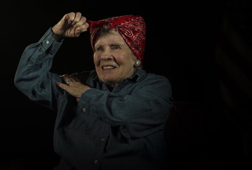 Margaret “Peggy” Wills, B-24 electrician during World War II, flexes her muscle at Minot Air Force Base, Feb. 9, 2017. Wills was a Rosie the Riveter at Holman Field in St. Paul, Minn. (U.S. Air Force photo/Senior Airman Apryl Hall)
