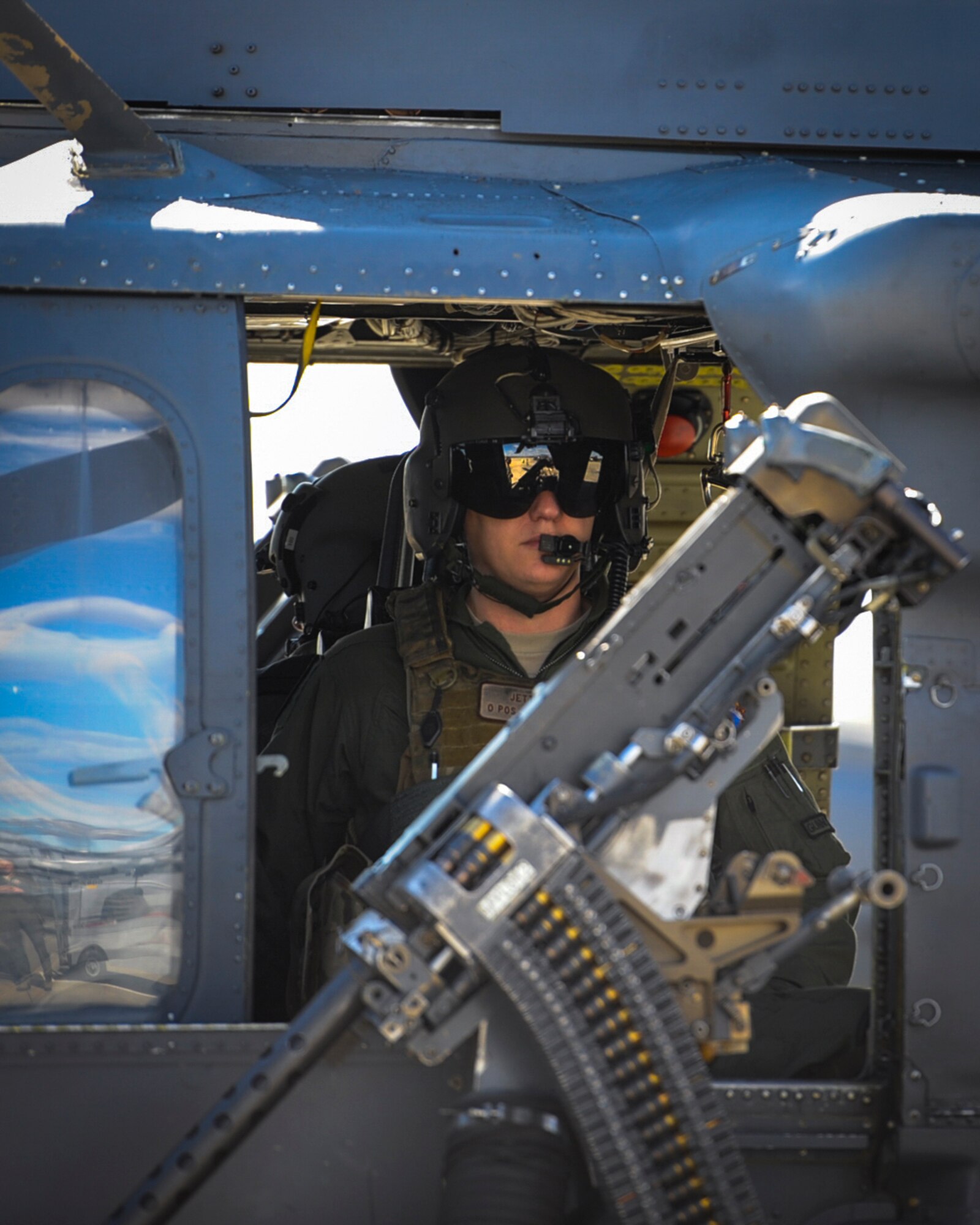 U.S. Air Force Master Sgt. Jonathan Jett, 41st Rescue Squadron NCO in charge of A-flight, prepares the weapon system of an HH-60G Pave Hawk helicopter for flight, Feb. 1, 2017, at Moody Air Force Base, Ga. The 41st RQS is an HH-60G personnel recovery squadron that specializes in search and rescue, medical evacuation, disaster response and humanitarian assistance. (U.S. Air Force photo by Airman 1st Class Lauren M. Sprunk)