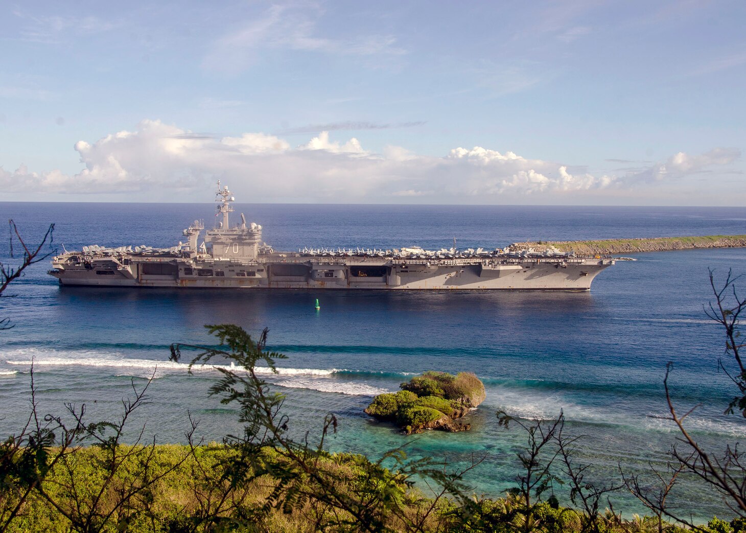 The Nimitz-class aircraft carrier USS Carl Vinson (CVN 70) pulls into Naval Base Guam,  Feb. 10. Vinson is on a regularly scheduled Western Pacific deployment with the Carl Vinson Carrier Strike Group as part of the U.S. Pacific Fleet-led initiative to extend the command and control functions of the U.S. 3rd Fleet in the Indo-Asia-Pacific region. Navy aircraft carrier strike groups have patrolled the Indo-Asia-Pacific regularly and routinely for more than 70 years. 
